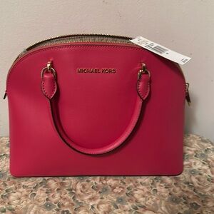 Michael Kors bright pink hand bag.  Brand  new with tags.  Excellent condition.